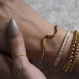 Woman Wearing Gold Ethereal Statement Bracelet Bangle Ring