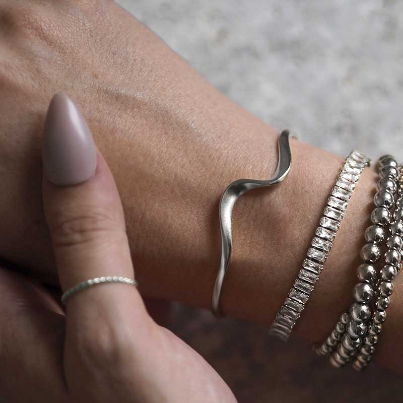 Woman Wearing Silver Ethereal Statement Bracelet Bangle Ring